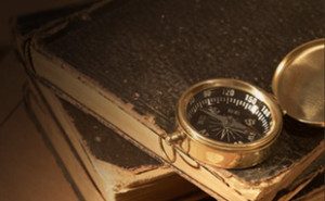 compass and old books